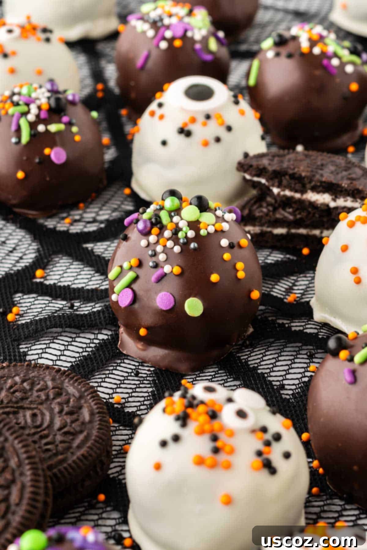 Spooky Oreo Truffles 19 A plate full of festive Halloween Oreo balls with dark and white chocolate coatings and various sprinkles