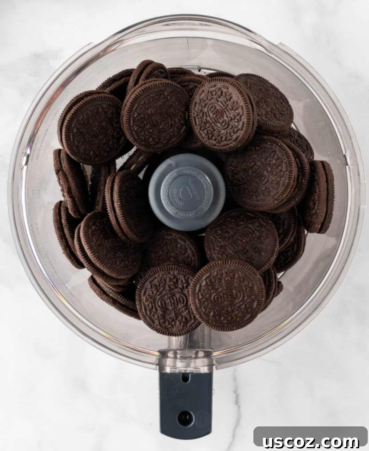 Spooky Oreo Truffles 5 Oreos in a food processor ready to be crushed