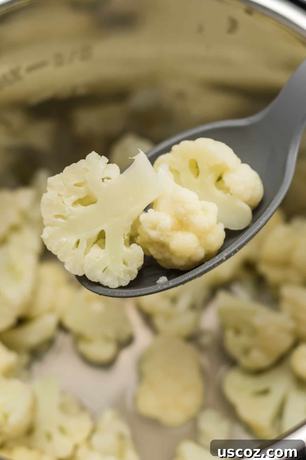 Easy Instant Pot Cauliflower 7 spoon taking cauliflower from the pot
