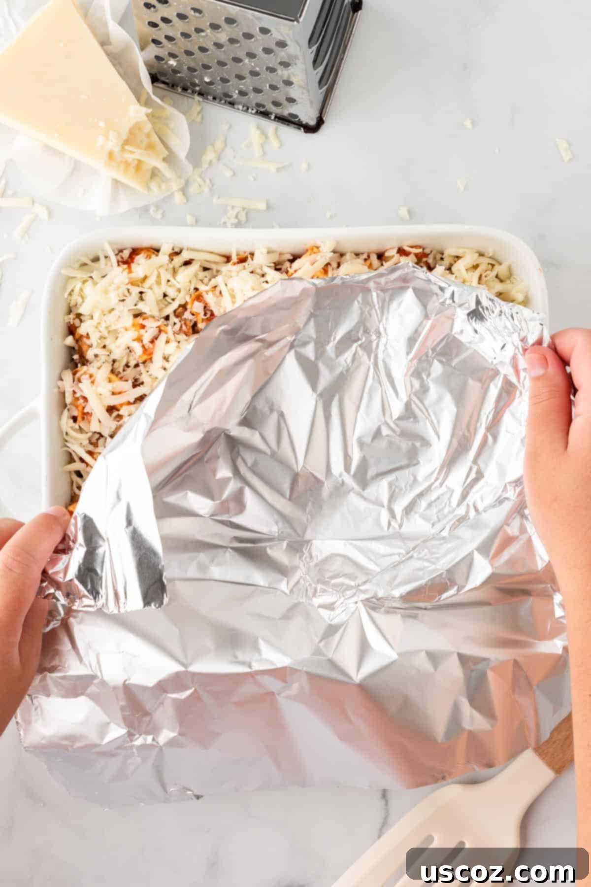 Cheesy Tortellini Bake 10 covering the baking dish with aluminum foil before baking