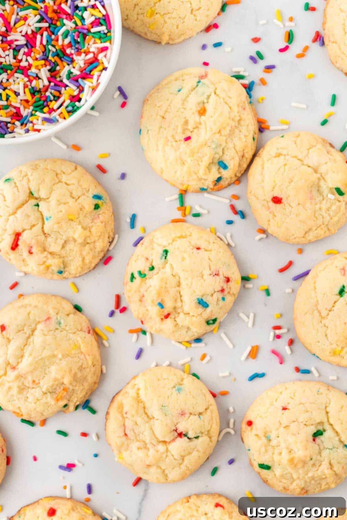 Effortless Rainbow Cake Cookies 13 A close-up shot of several funfetti cake mix cookies, showcasing their bright sprinkles and appealing texture.