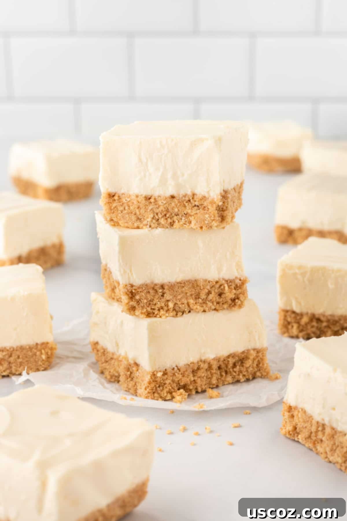 Creamy No-Bake Cheesecake Bliss 18 stacked no bake cheesecake bars, showcasing their perfect layers