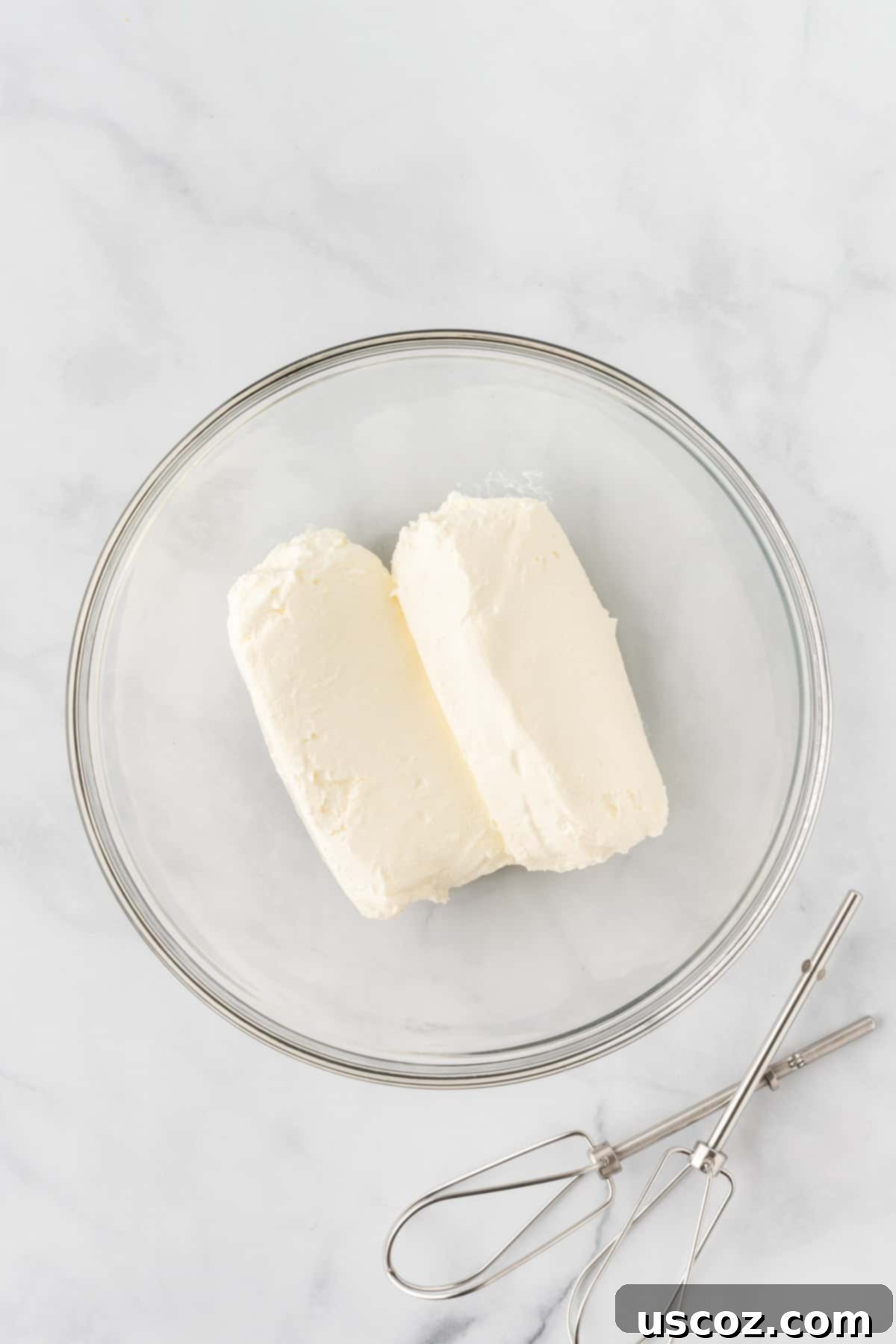 Creamy No-Bake Cheesecake Bliss 9 blocks of cream cheese in a mixing bowl, ready to be beaten