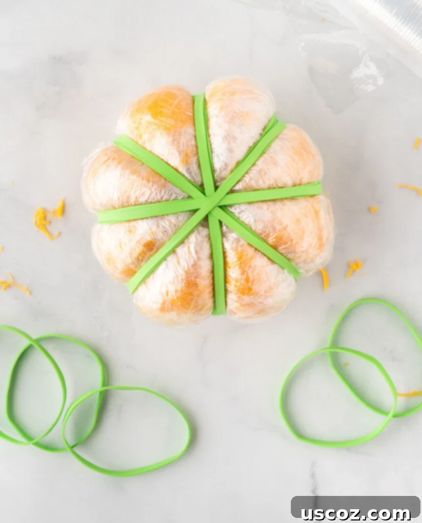 Spiced Pumpkin Cheese Ball 12 cheese ball shaped with rubber bands to look like a pumpkin