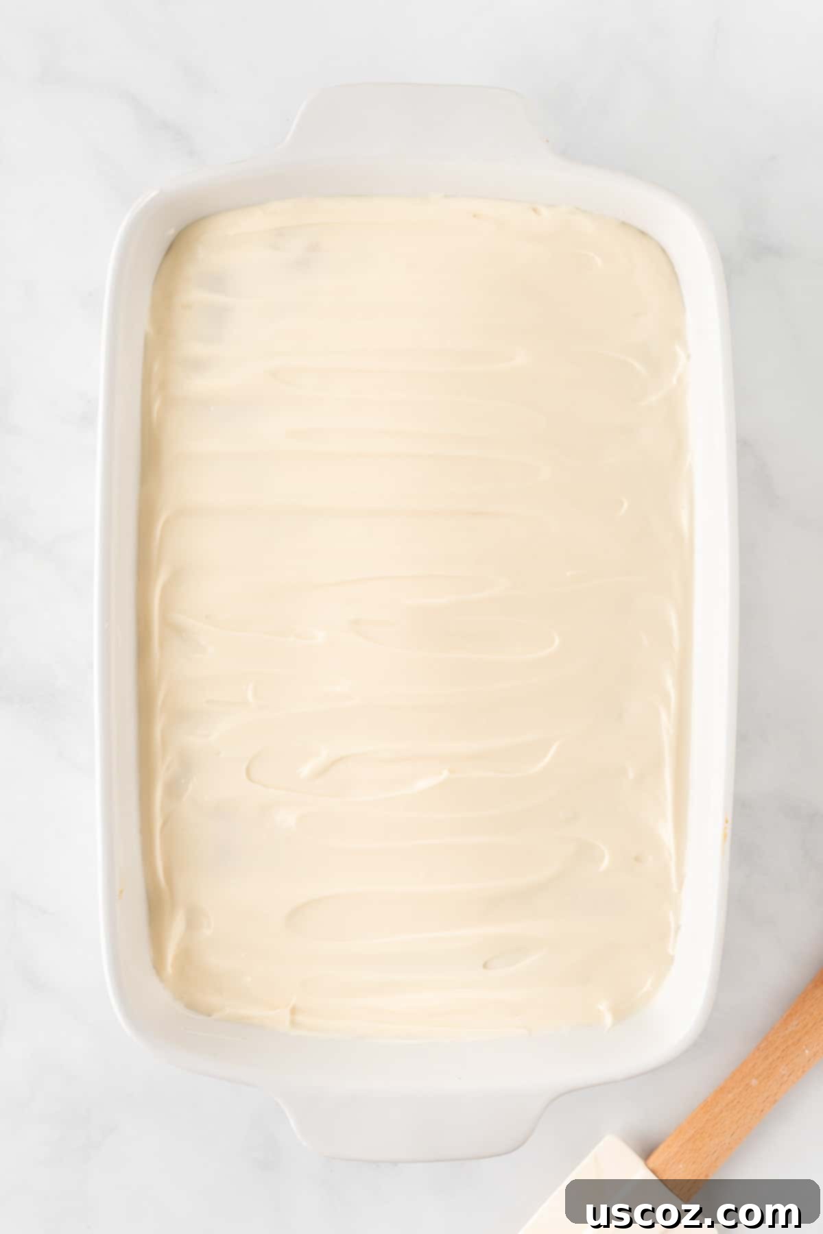 Easy Cake Mix Pumpkin Bars 10 a 9 by 13 baking dish of pumpkin bars beautifully topped with cream cheese frosting