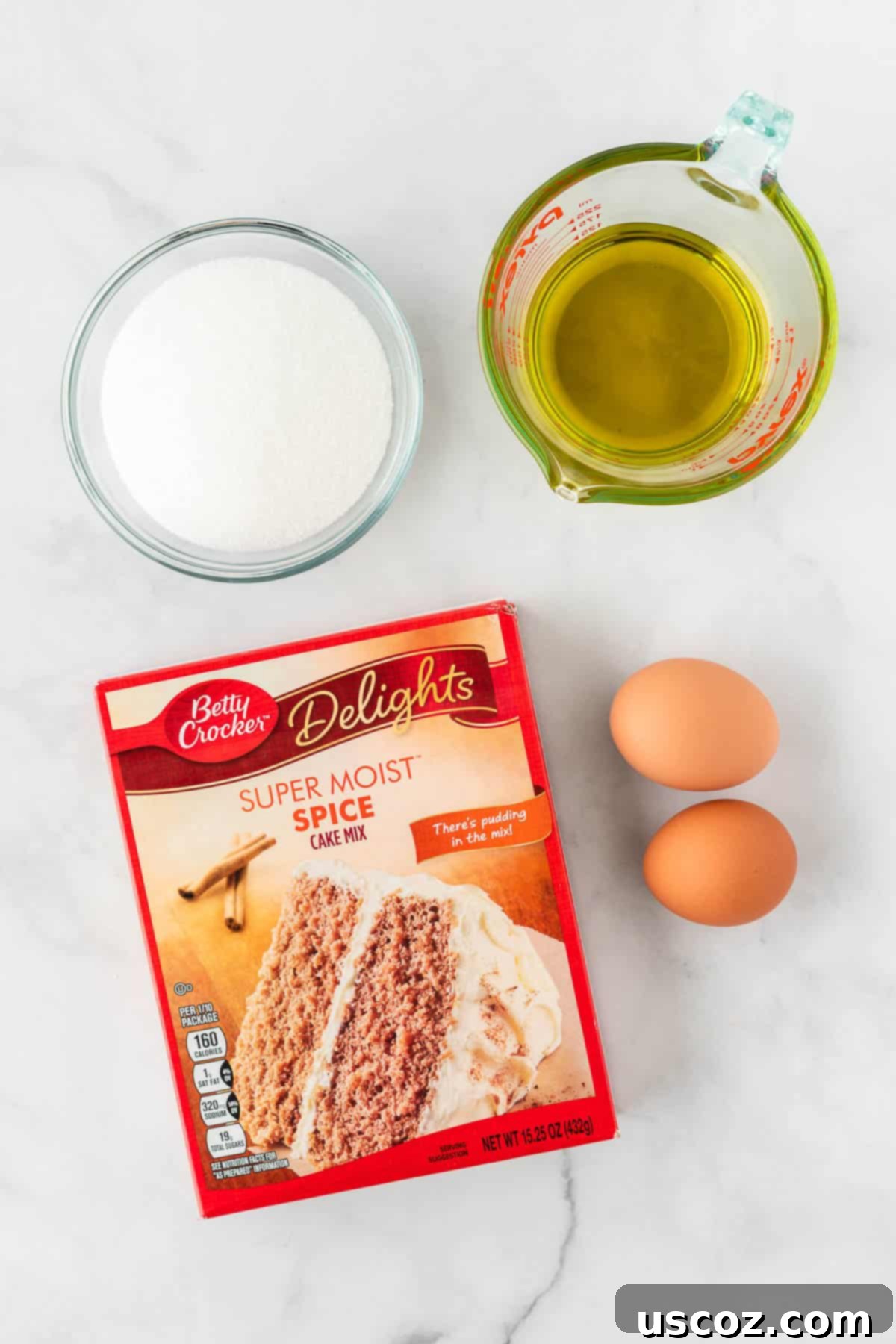 Quick Cake Mix Spice Cookies 4 The four simple ingredients for cake mix spice cookies: a box of spice cake mix, eggs, olive oil, and coarse granulated sugar.