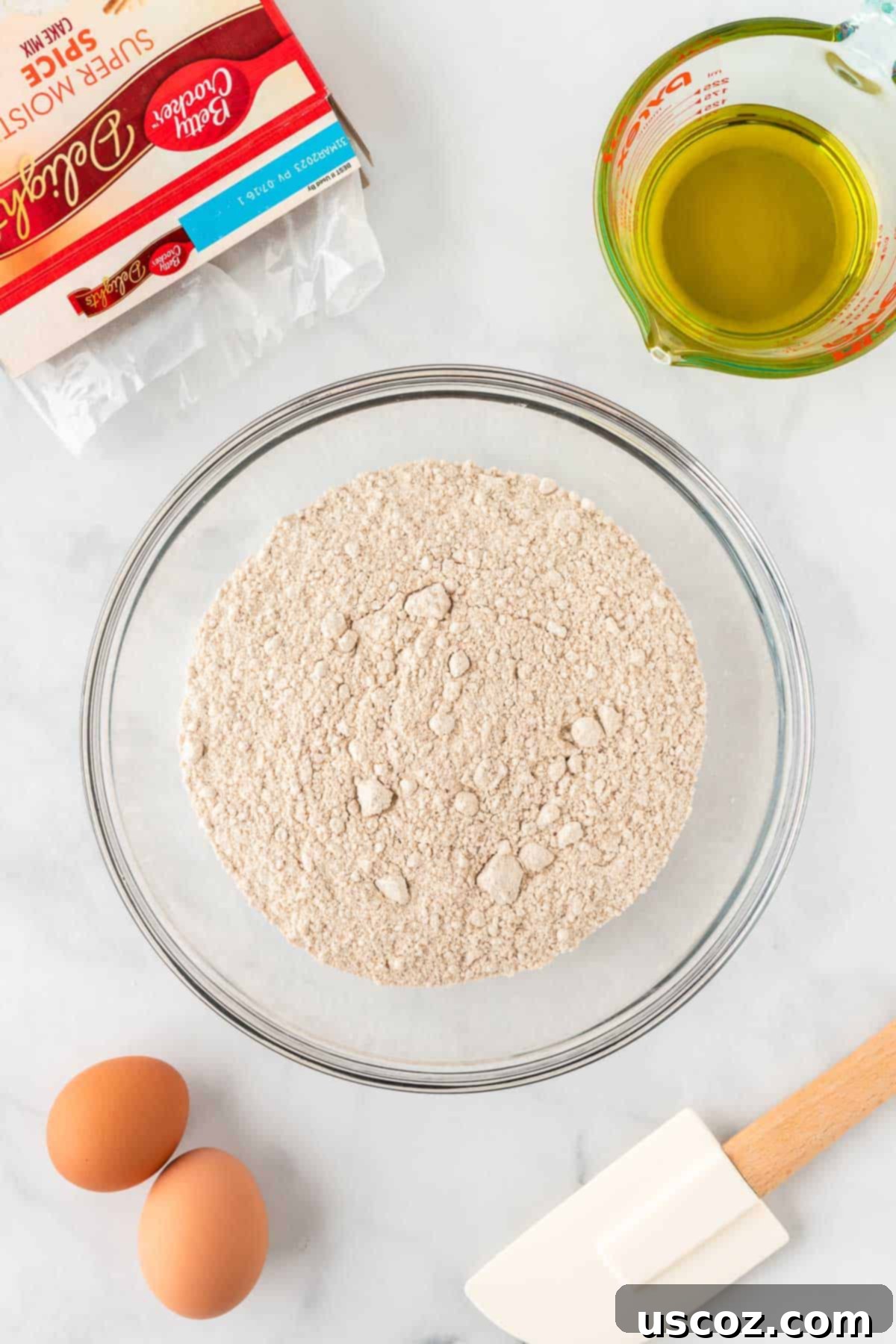 Quick Cake Mix Spice Cookies 5 A mixing bowl filled with dry spice cake mix, ready for wet ingredients to be added.