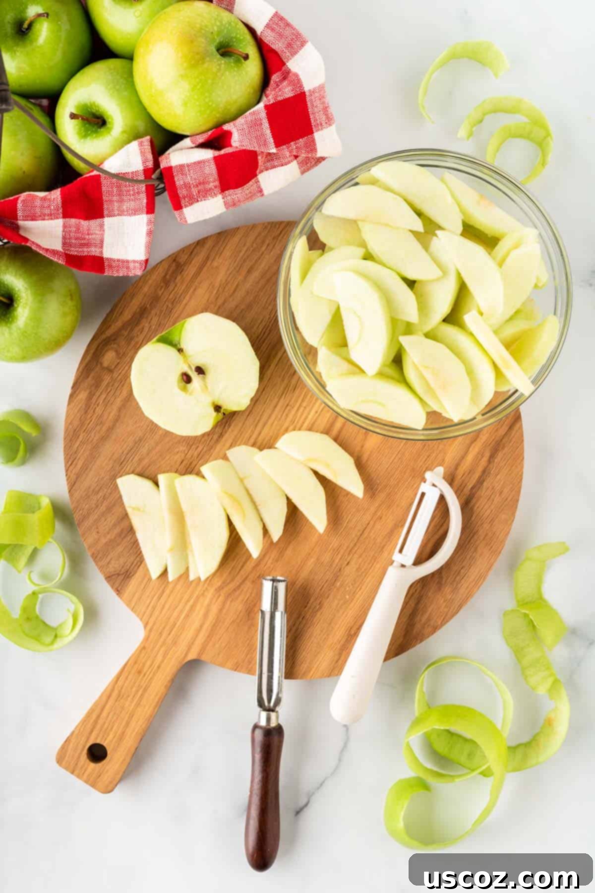 Warm Baked Cinnamon Apples 4 Close-up of a hand peeling and slicing fresh apples, preparing them for baking.