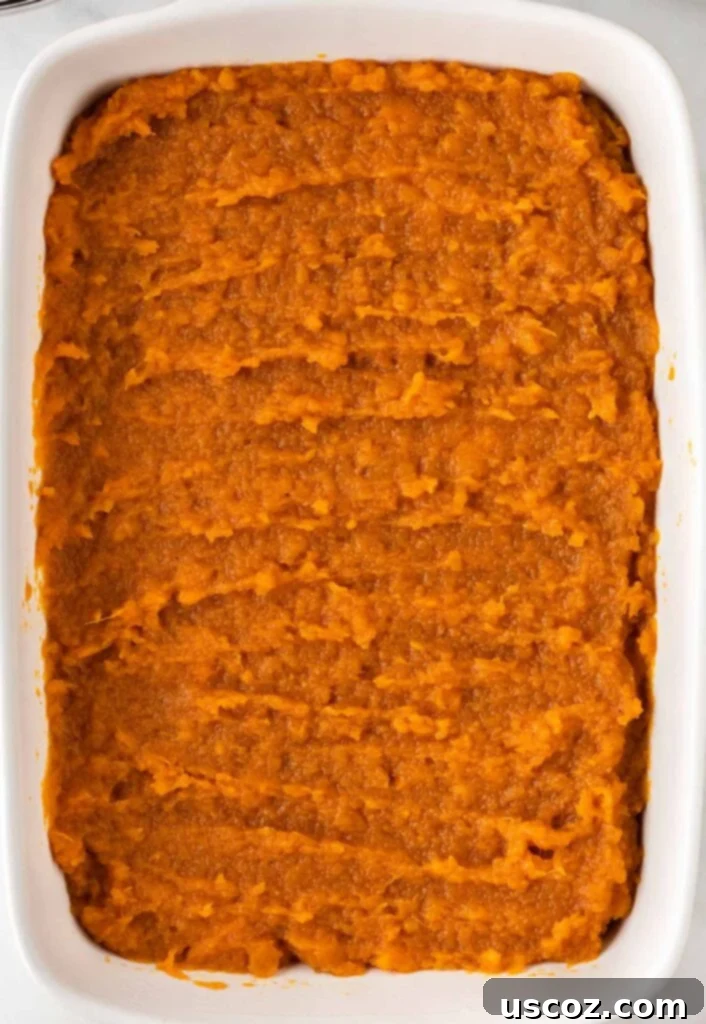 Golden Sweet Potato Marshmallow Bake 14 sweet potato casserole filling in a baking dish