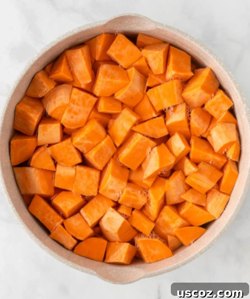 Golden Sweet Potato Marshmallow Bake 6 sweet potatoes being boiled in water