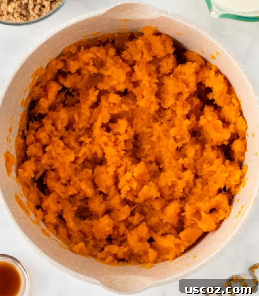 Golden Sweet Potato Marshmallow Bake 9 mashed sweet potatoes in a sauce pan