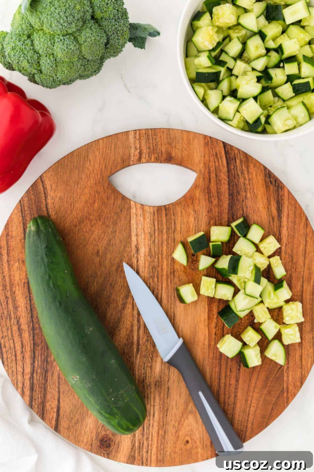 Creamy Ranch Pasta Salad 7 dicing up cucumber