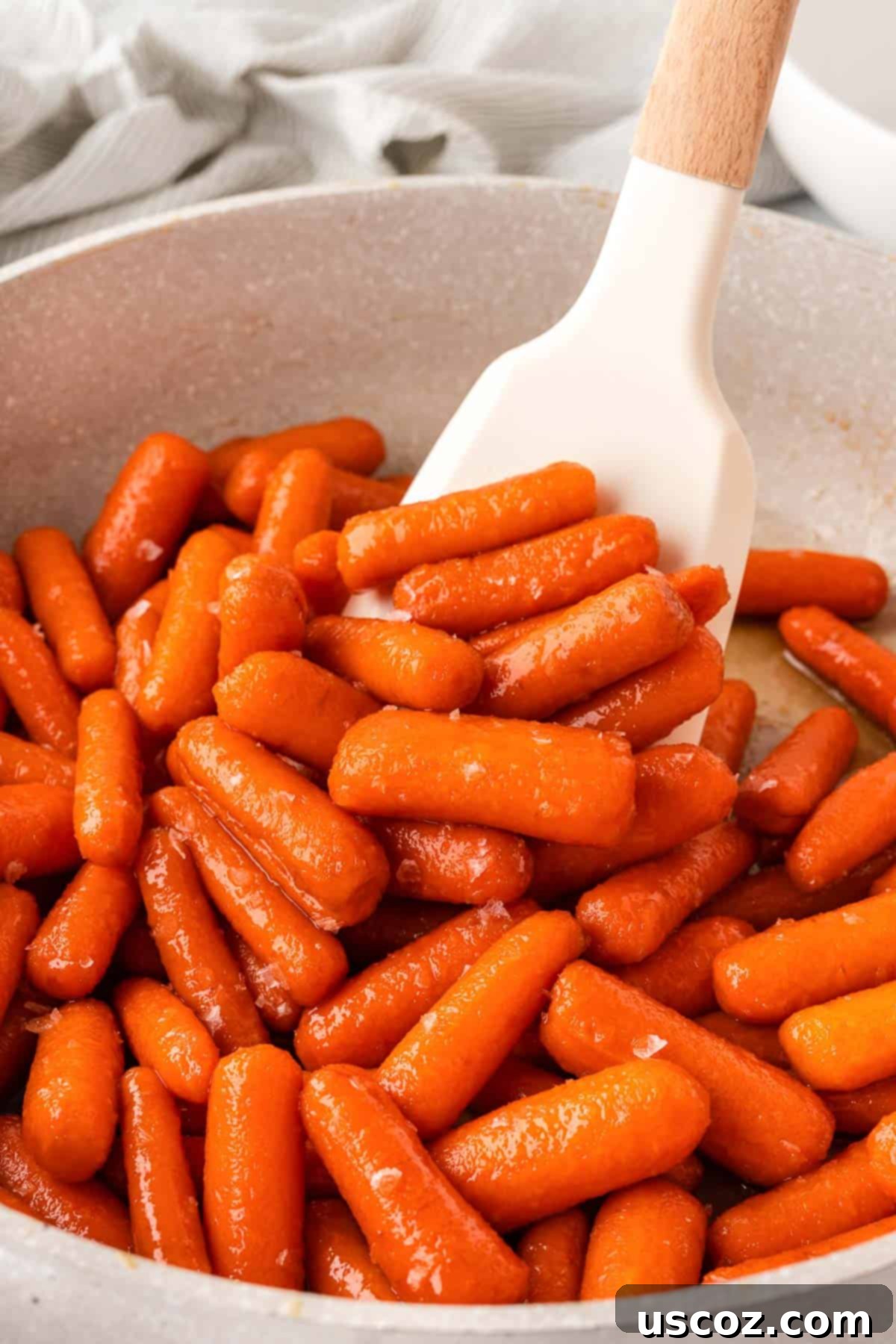 Sweet & Sticky Honey Brown Sugar Carrots 3 stirring the glazed carrots