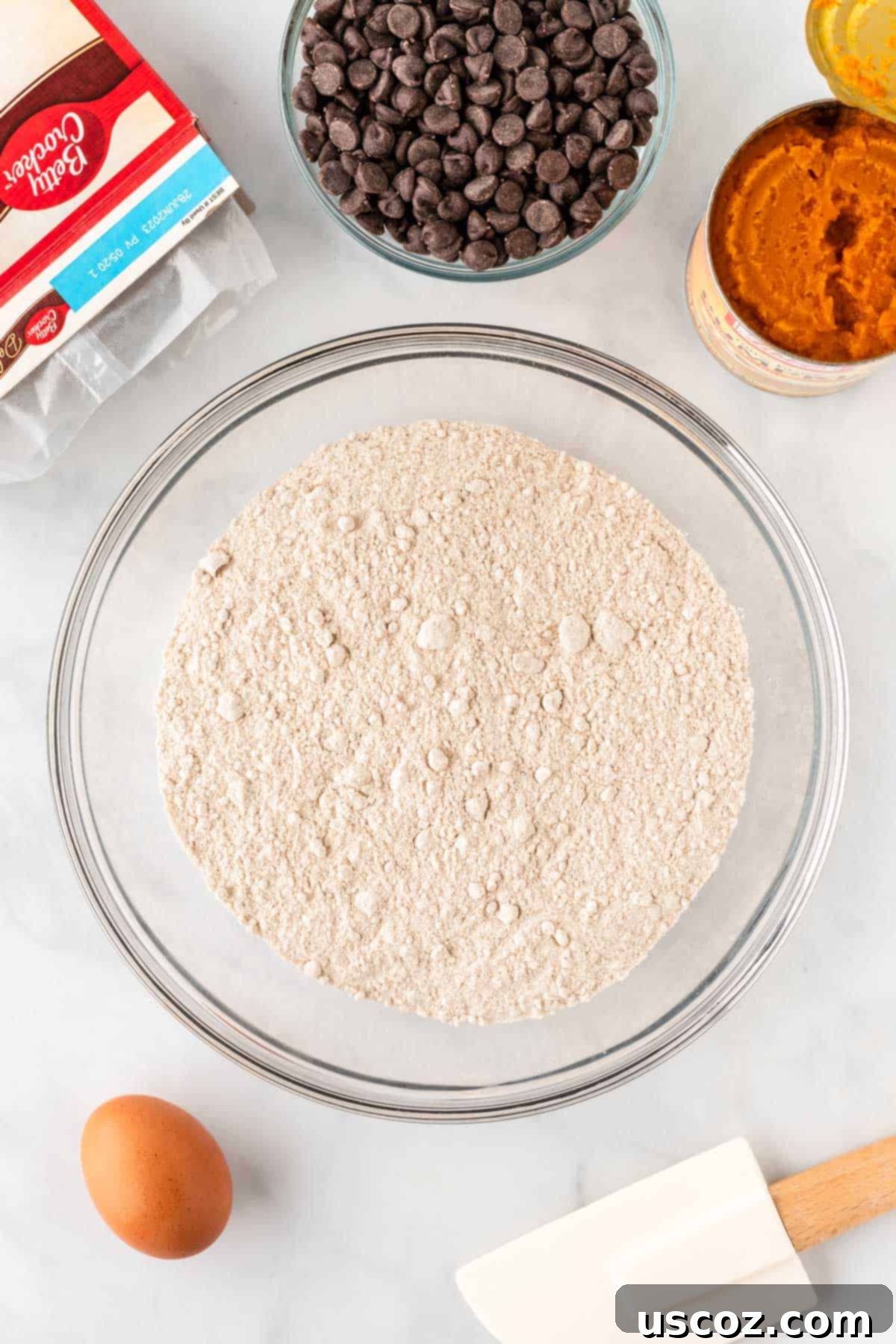 Easy Pumpkin Cake Mix Cookies 6 spice cake mix poured into a mixing bowl
