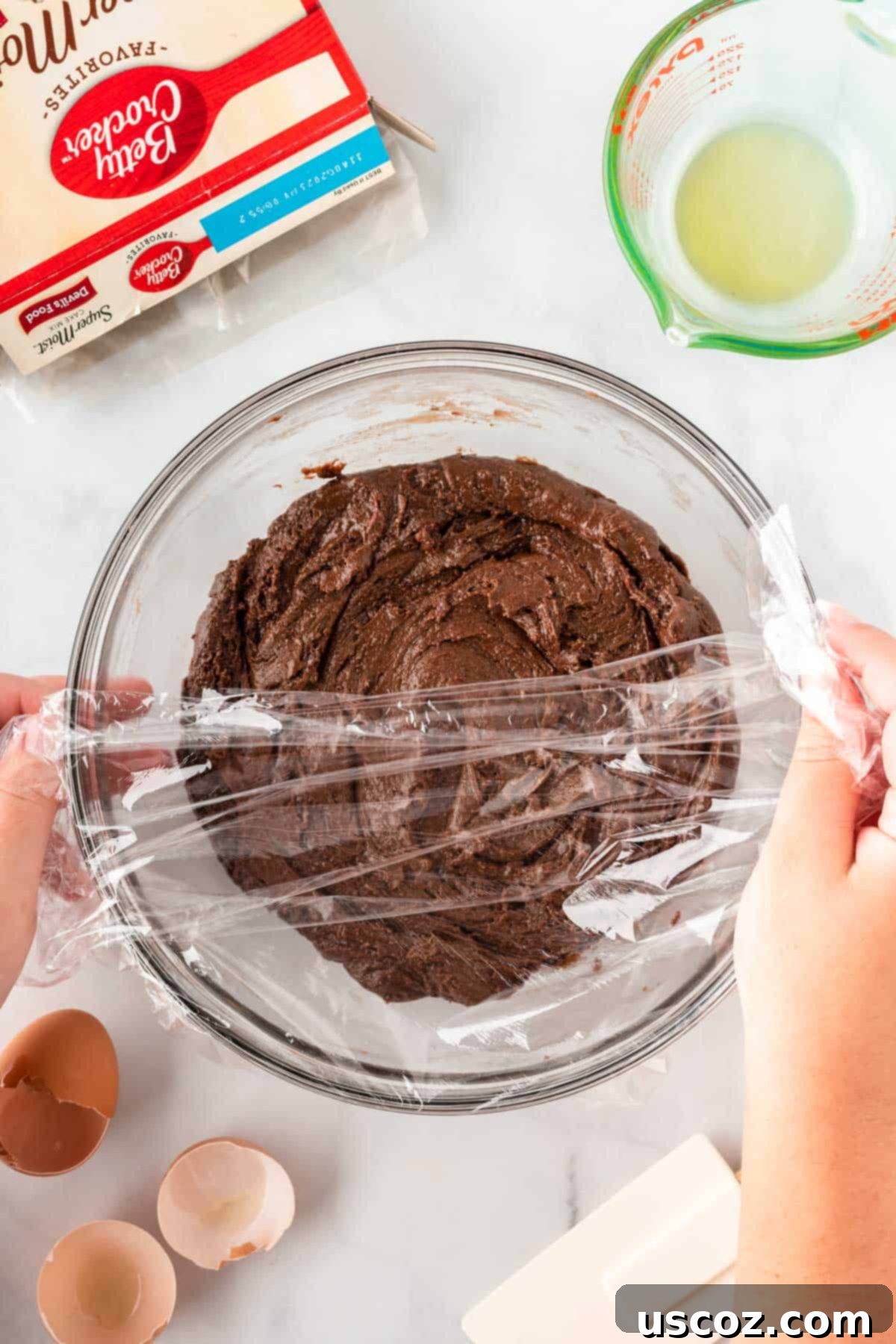 Irresistible Cake Mix Crinkles 8 covering the cookie dough with plastic wrap