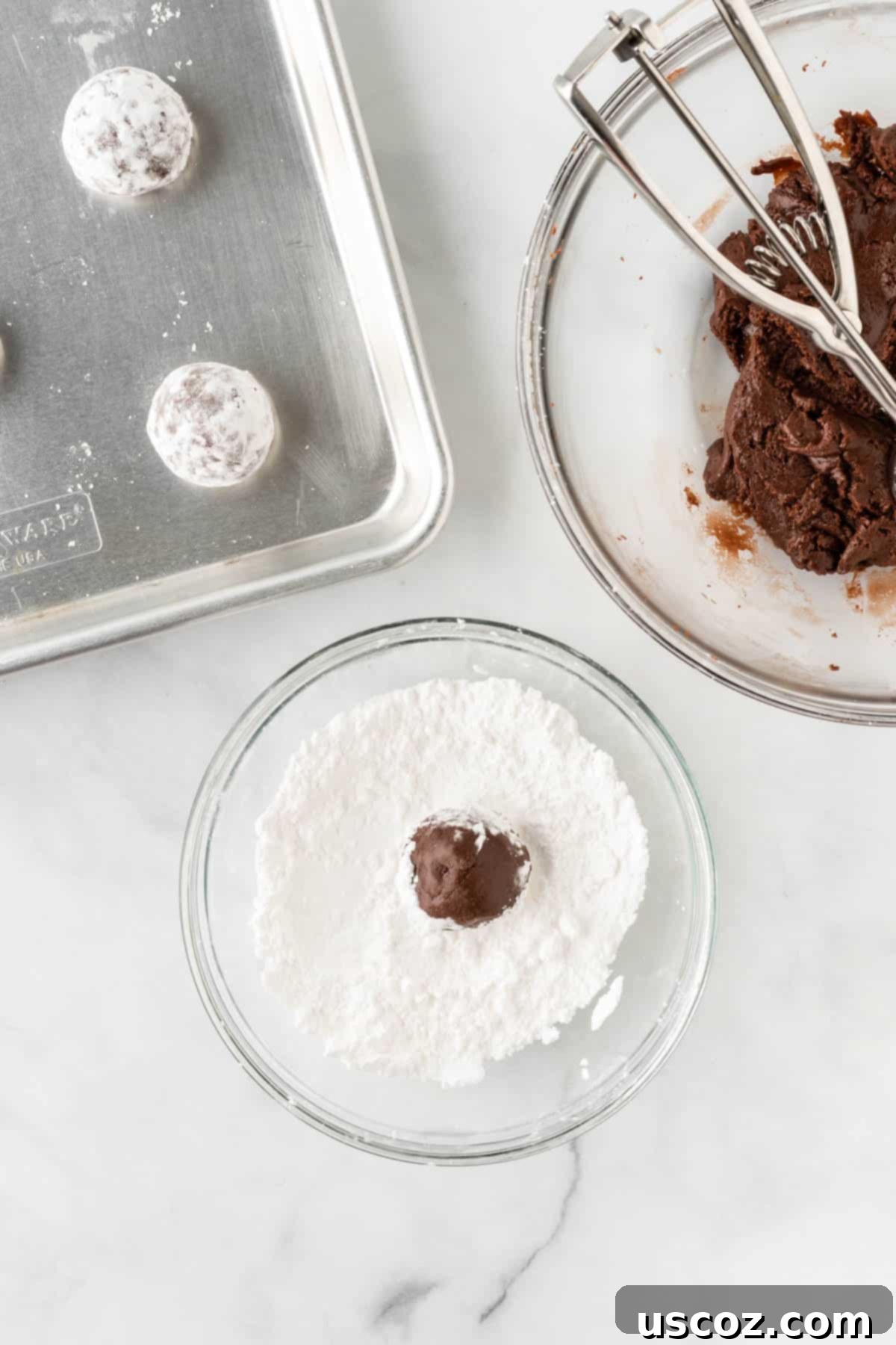 Irresistible Cake Mix Crinkles 9 rolling a ball of dough in powdered sugar