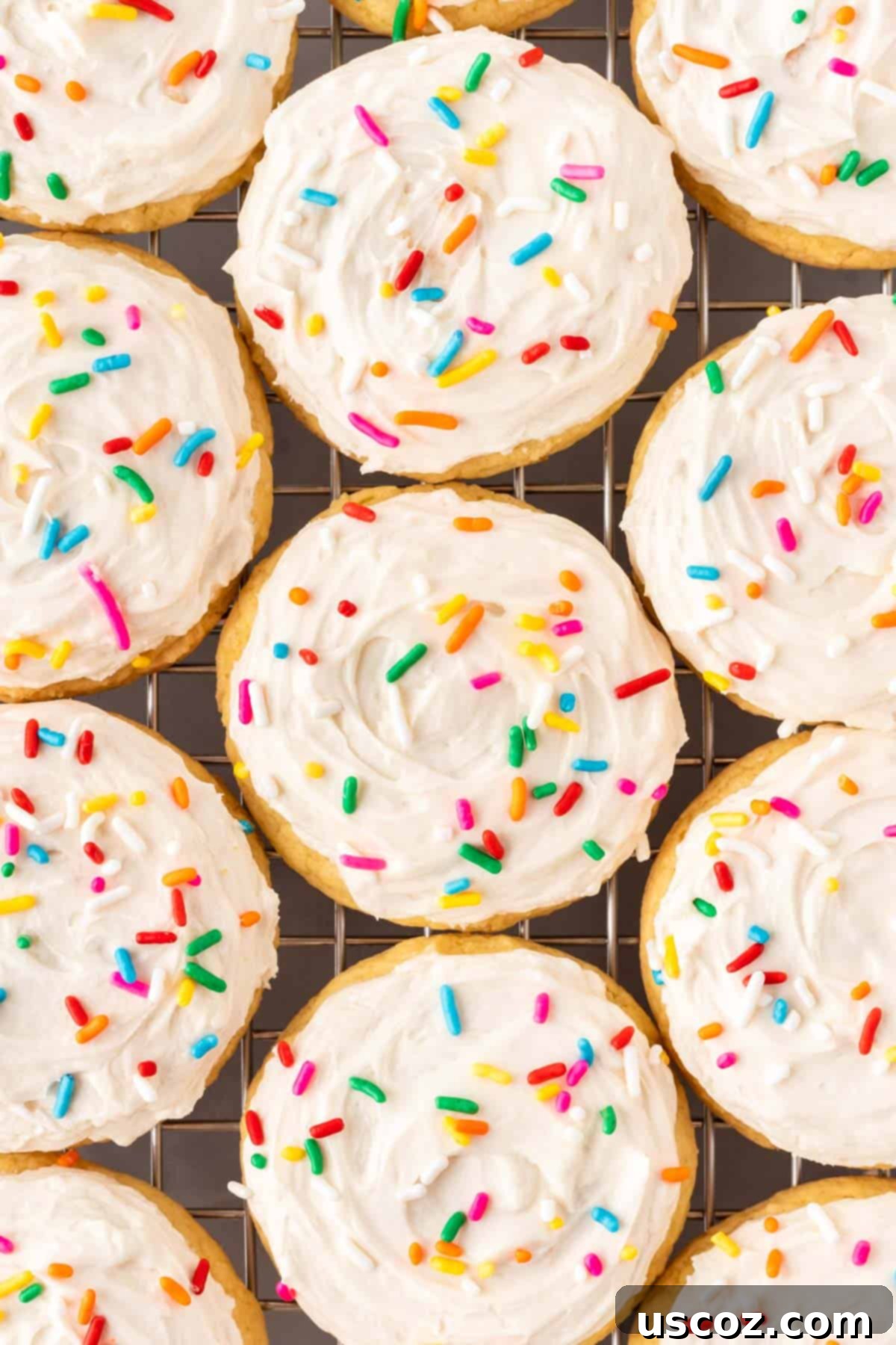 Effortless Cake Mix Sugar Cookies 2 frosted sugar cookies with sprinkles