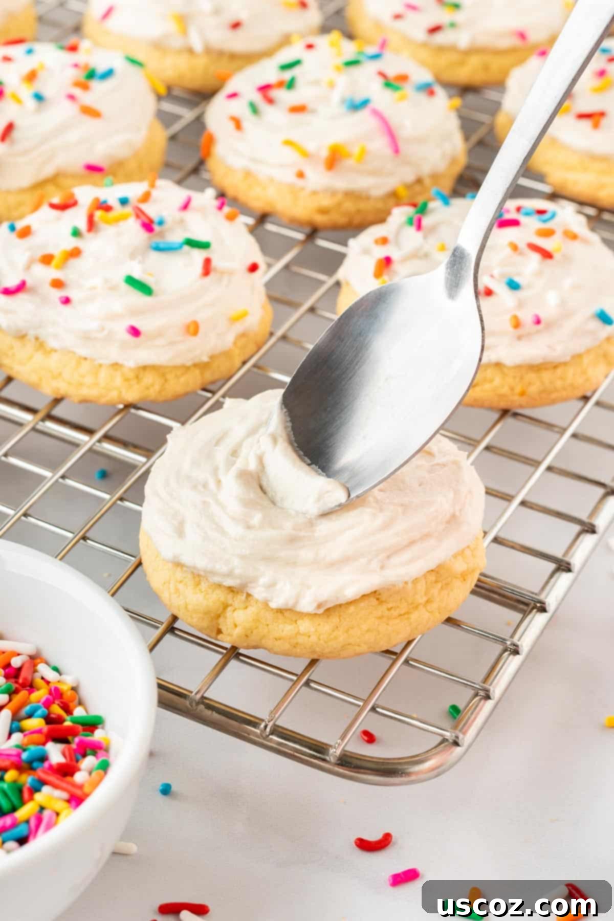 Effortless Cake Mix Sugar Cookies 11 topping the sugar cookies with frosting