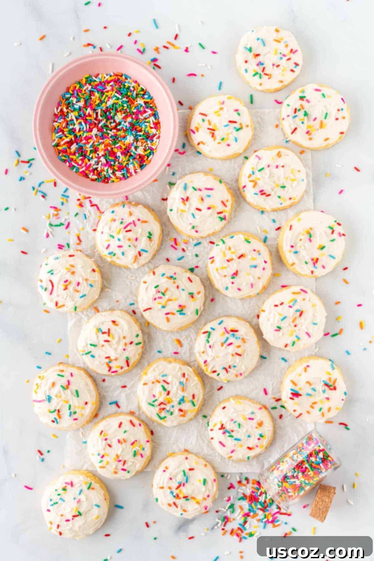 Effortless Cake Mix Sugar Cookies 3 cake mix sugar cookies topped with frosting and sprinkles