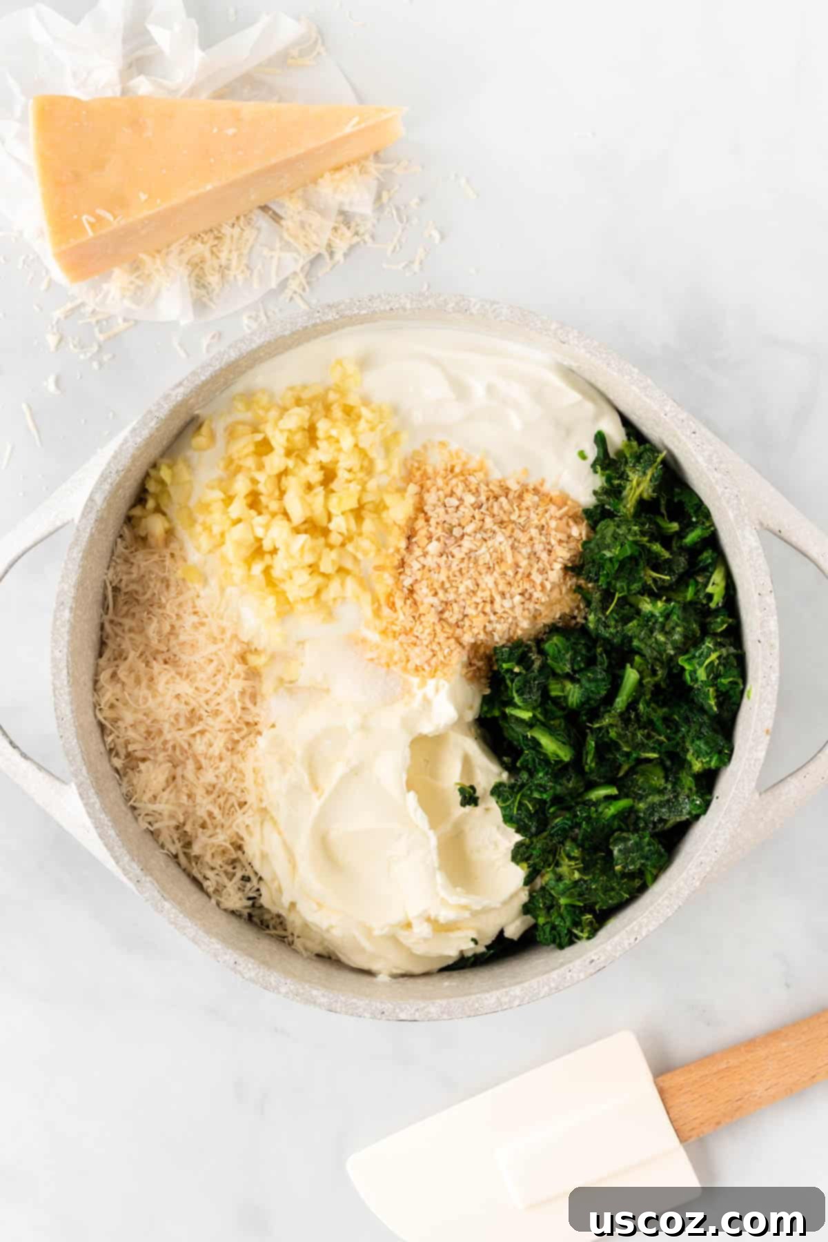 Decadent Creamy Spinach Dip 5 adding the dip ingredients to a sauce pan