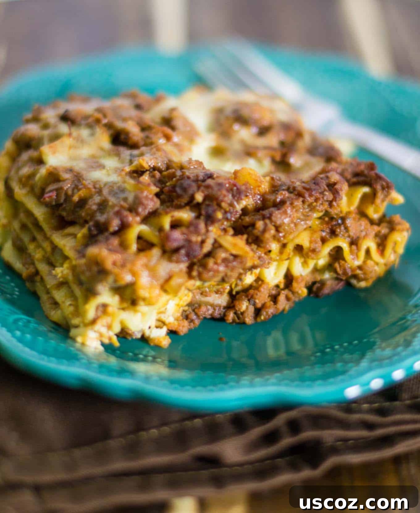 A large baking dish filled with cheesy meaty vegetarian lasagna