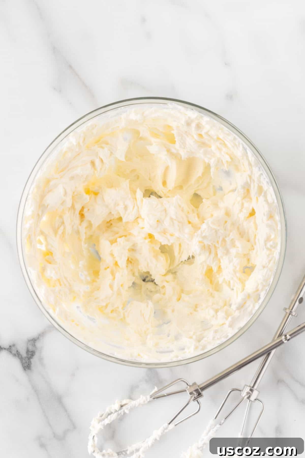 Creamy Oreo Dip 5 Smooth, whipped cream cheese in a bowl