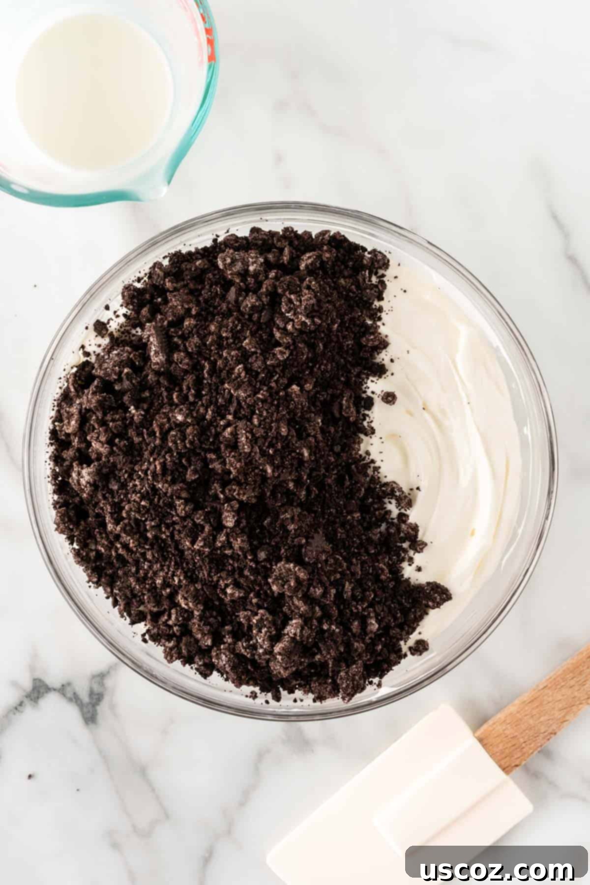 Creamy Oreo Dip 7 Adding crushed Oreo pieces to the cream cheese and whipped cream mixture