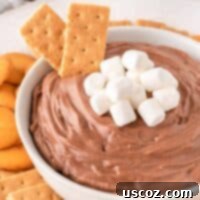 Cozy Chocolate Dip 14 Hot chocolate dip topped with mini marshmallows, a perfect holiday dessert.