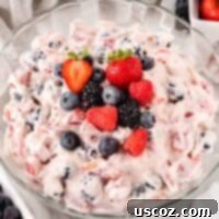 Creamy Cheesecake Fruit Delight 15 cheesecake salad topped with fresh berries