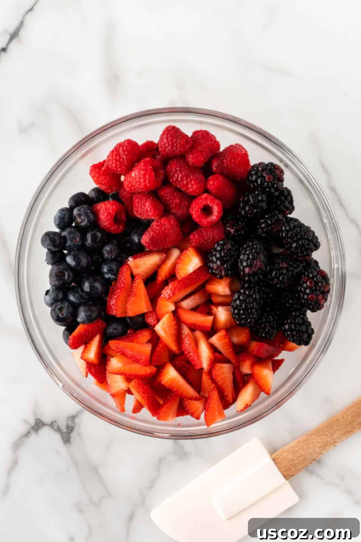 Creamy Cheesecake Fruit Delight 10 strawberries, blackberries, raspberries, and blueberries in a bowl
