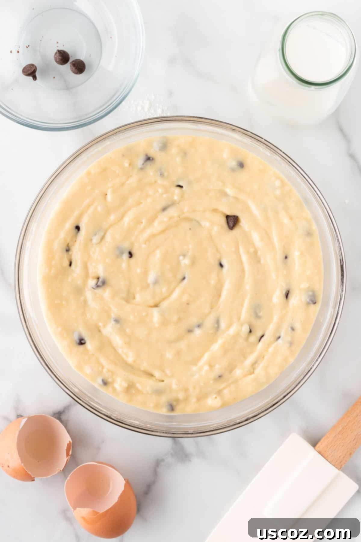Perfect Bakery Style Chocolate Chip Muffins 11 Muffin batter in a mixing bowl after chocolate chips have been gently folded in