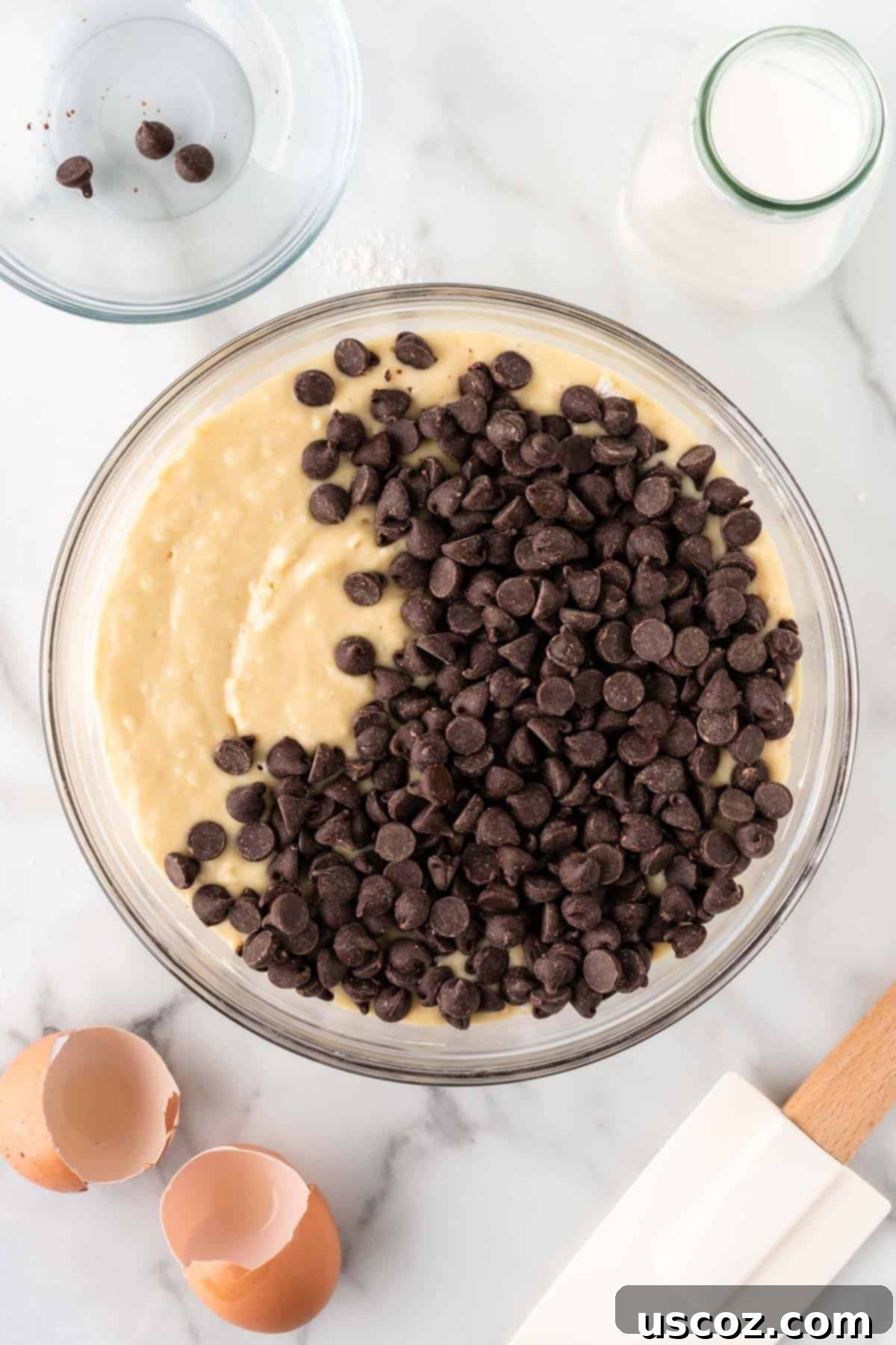 Perfect Bakery Style Chocolate Chip Muffins 10 Adding semi-sweet chocolate chips to the gently mixed muffin batter