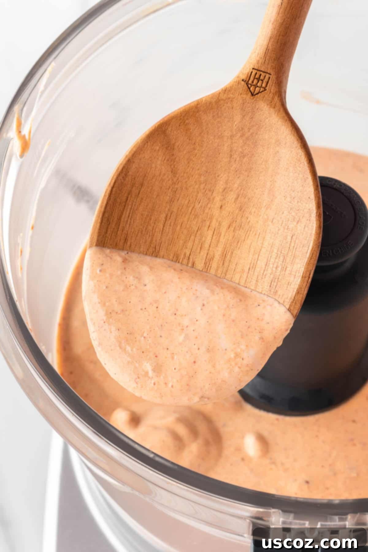 Smoky Ranch Kick 8 wooden spoon dipped in southwest salad dressing