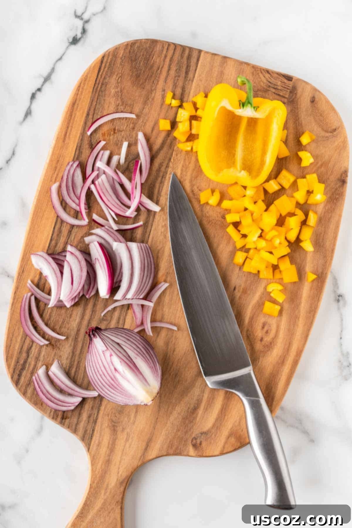 Southwest Fiesta Salad 4 cut up bell pepper and onion on a cutting board
