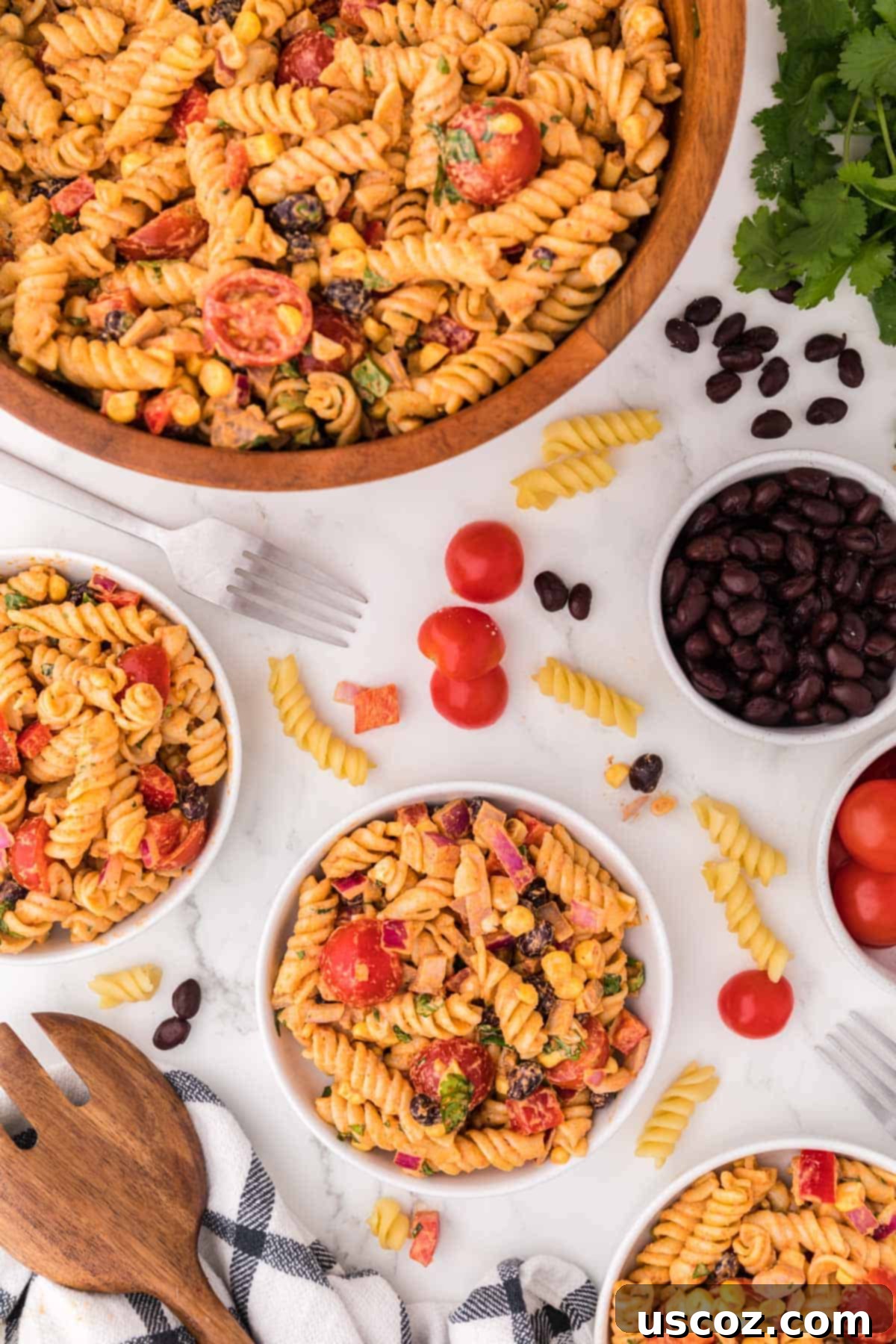 Zesty Southwest Pasta Delight 11 A serving plate with a portion of Southwest Pasta Salad, showcasing its vibrant ingredients, next to the main serving bowl.