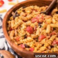 Zesty Southwest Pasta Delight 13 Southwest Pasta Salad in a bowl with ingredients around it