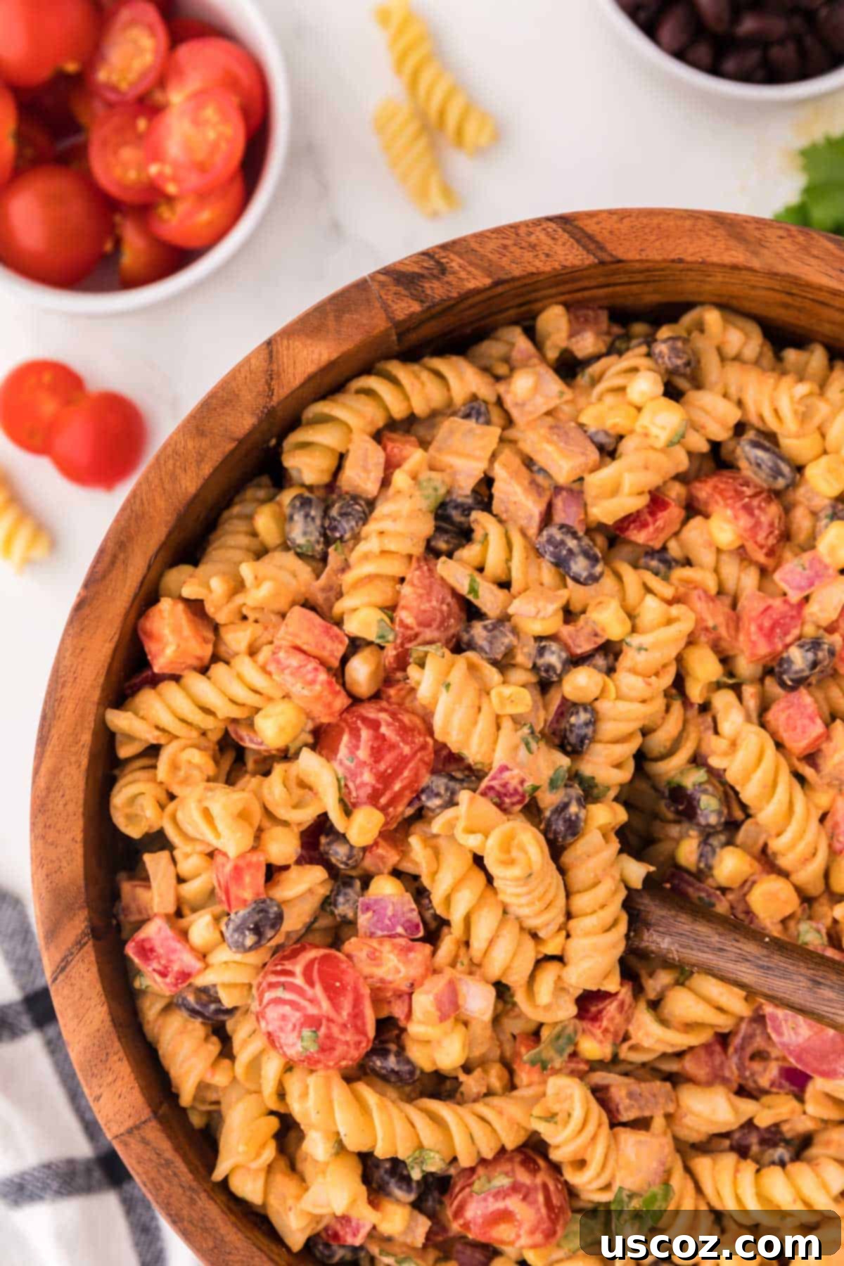 Zesty Southwest Pasta Delight 10 A brown serving bowl filled with the fully dressed Southwest Pasta Salad, ready to be chilled or served, showcasing its vibrant colors and creamy texture.