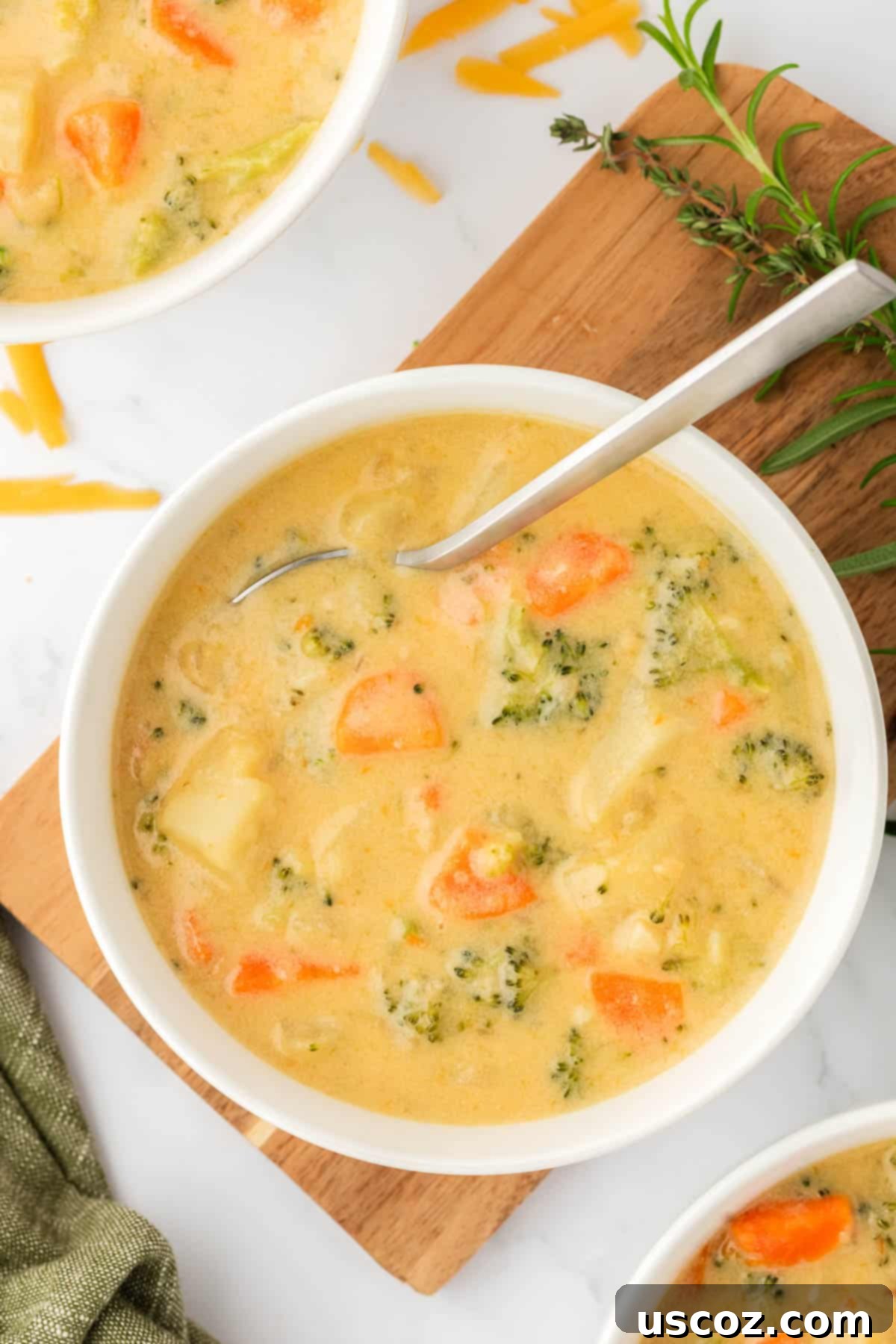 Velvet Veggie Delight 20 A steaming bowl of creamy vegetable soup with a spoon, ready to be enjoyed as a comforting and nourishing meal.