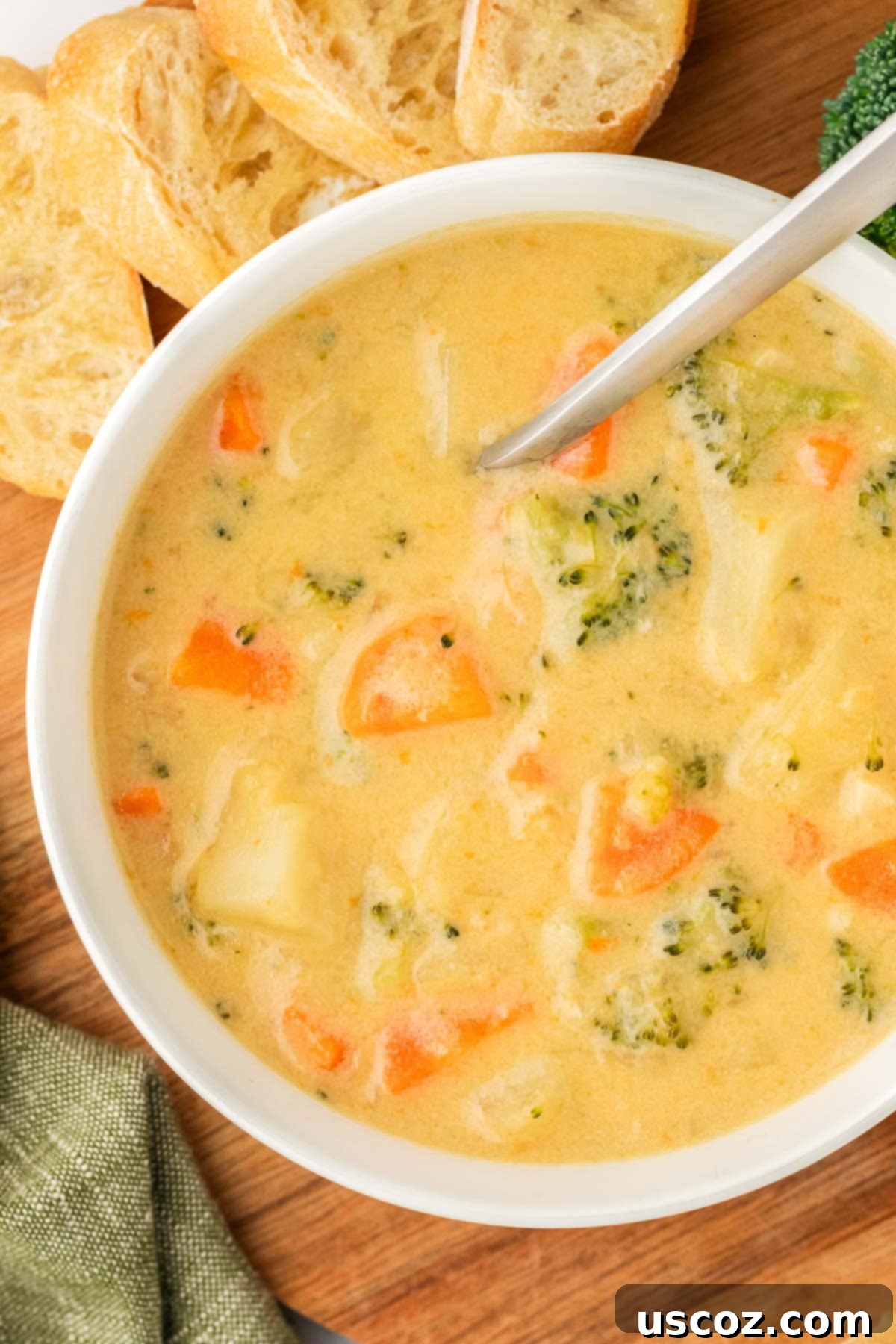 Velvet Veggie Delight 21 A cozy scene featuring a bowl of creamy vegetable soup and a spoon, inviting a warm and comforting meal experience.