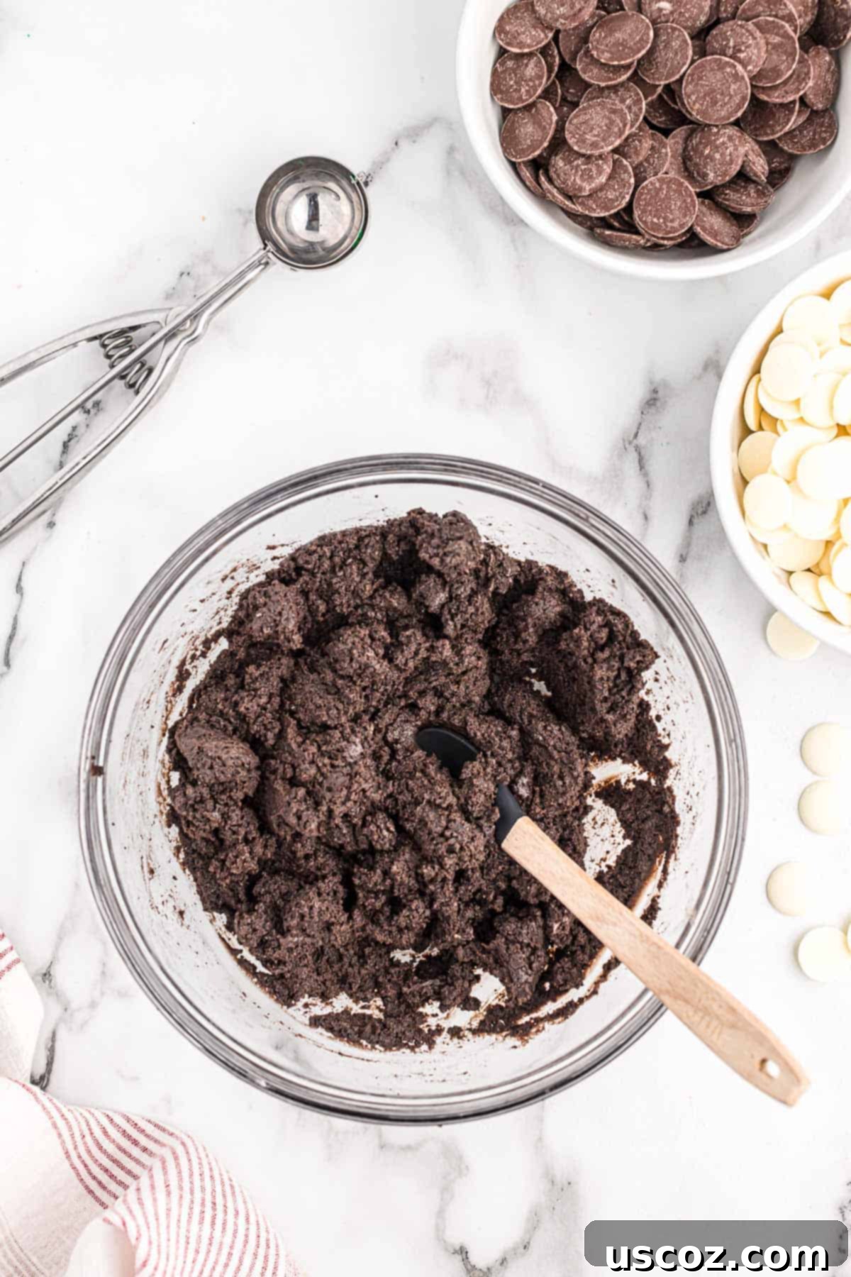 Oreo Truffles 5 A creamy, dark brown Oreo truffle filling in a mixing bowl, showcasing the perfect blend of crushed Oreos and cream cheese.