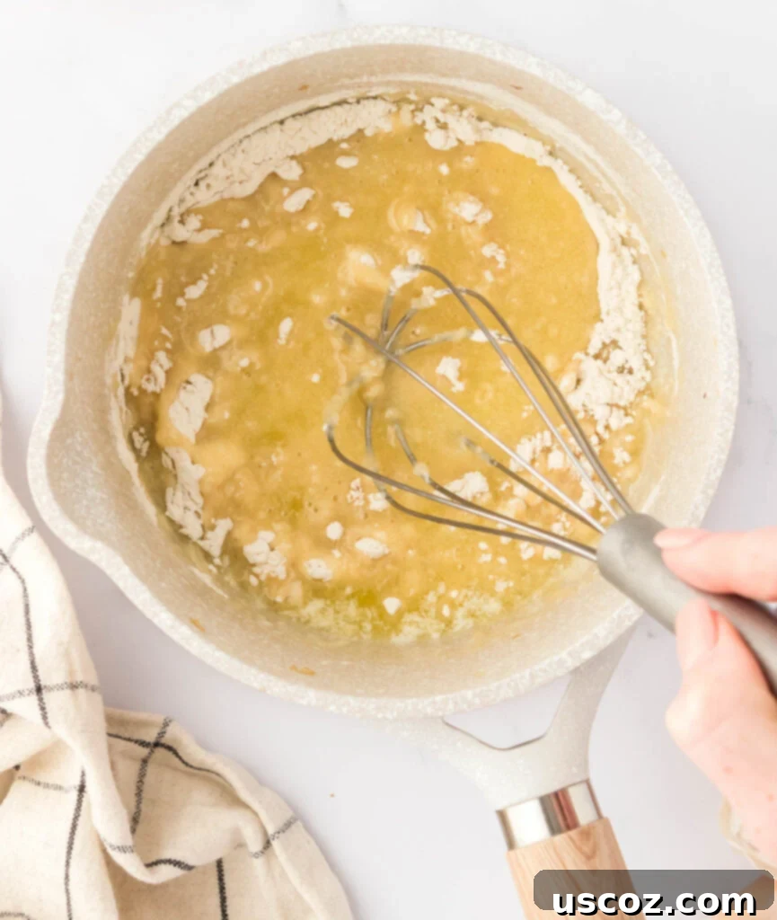 Perfect Vegetarian Gravy 14 Vigorously whisking flour into melted butter, forming a smooth roux.