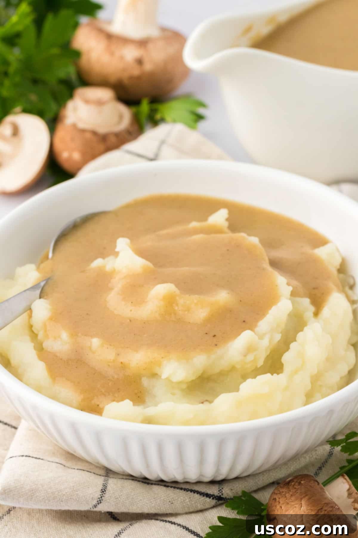 Perfect Vegetarian Gravy 3 Creamy vegetarian gravy generously poured over fluffy mashed potatoes, a comforting side dish