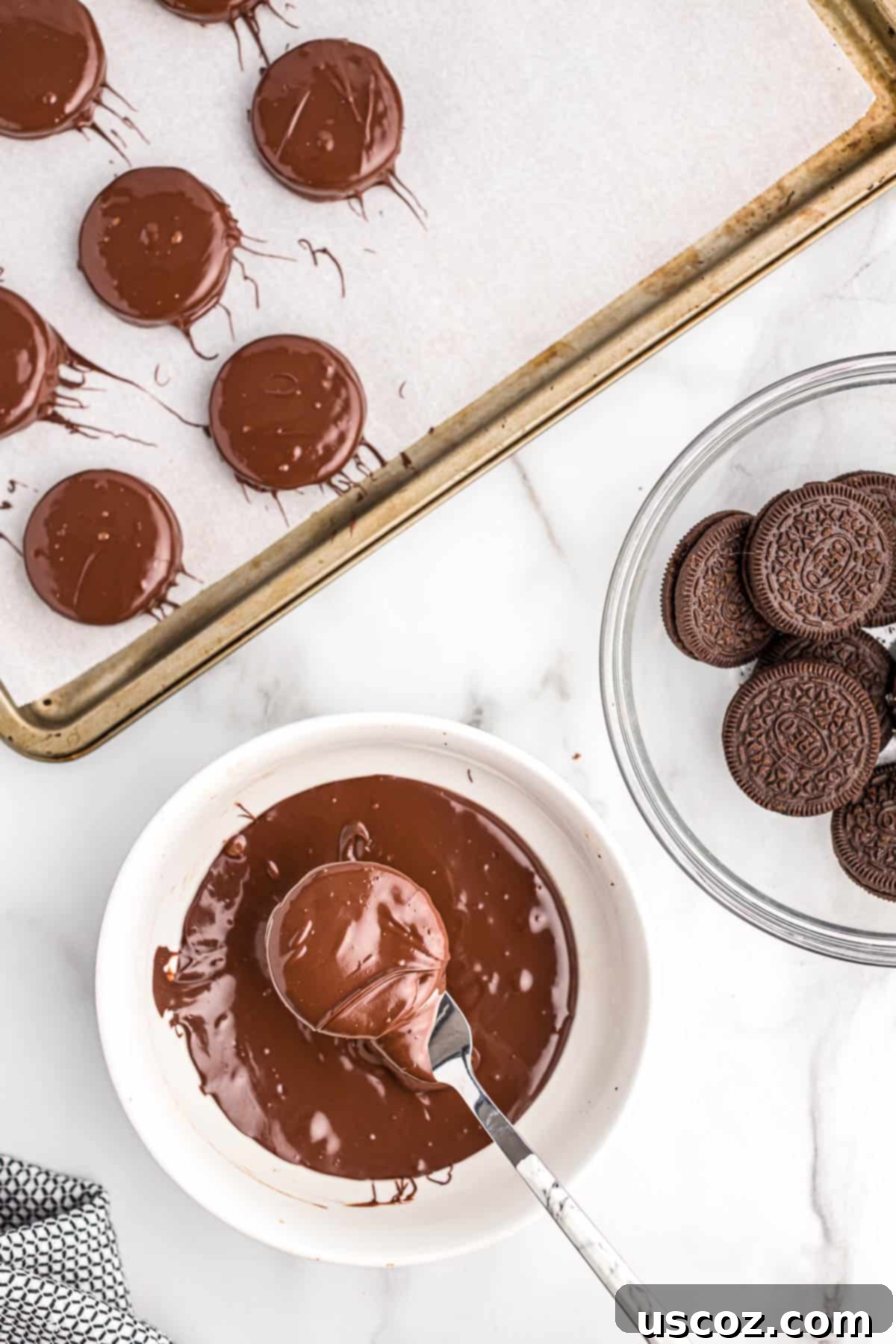 Decadent Chocolate Dipped Oreos 5 dipping an oreo into melted chocolate