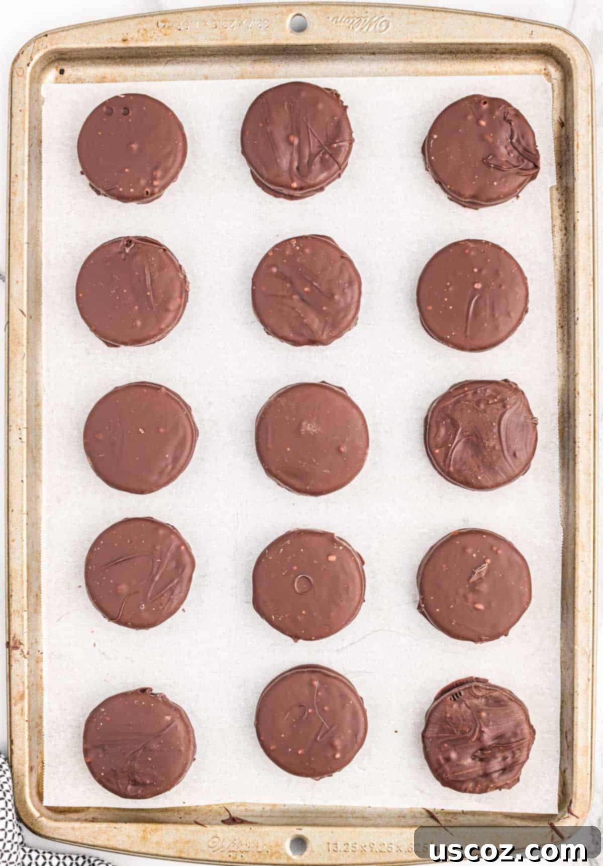 Decadent Chocolate Dipped Oreos 6 chocolate dipped oreos on a baking sheet
