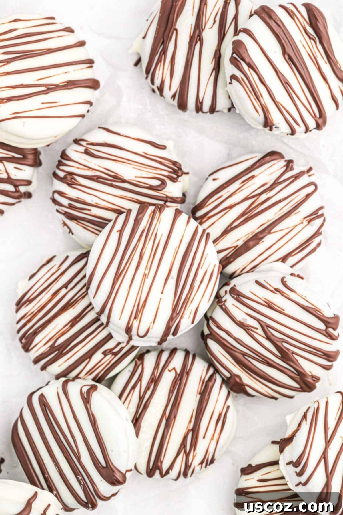 Decadent White Chocolate Oreos 10 white chocolate covered Oreos drizzled with dark chocolate