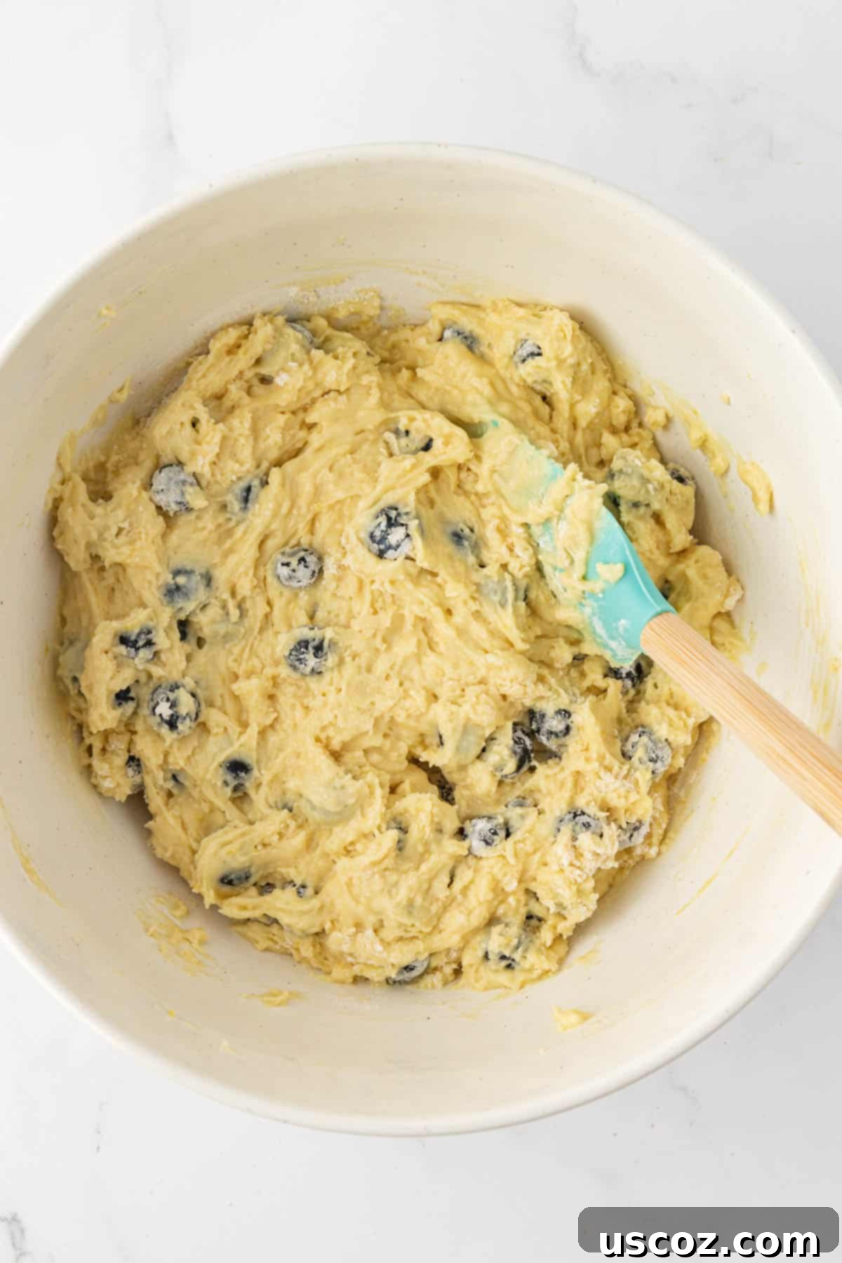 Sumptuous Sour Cream Blueberry Muffins 11 Flour-coated blueberries gently folded into the muffin batter.