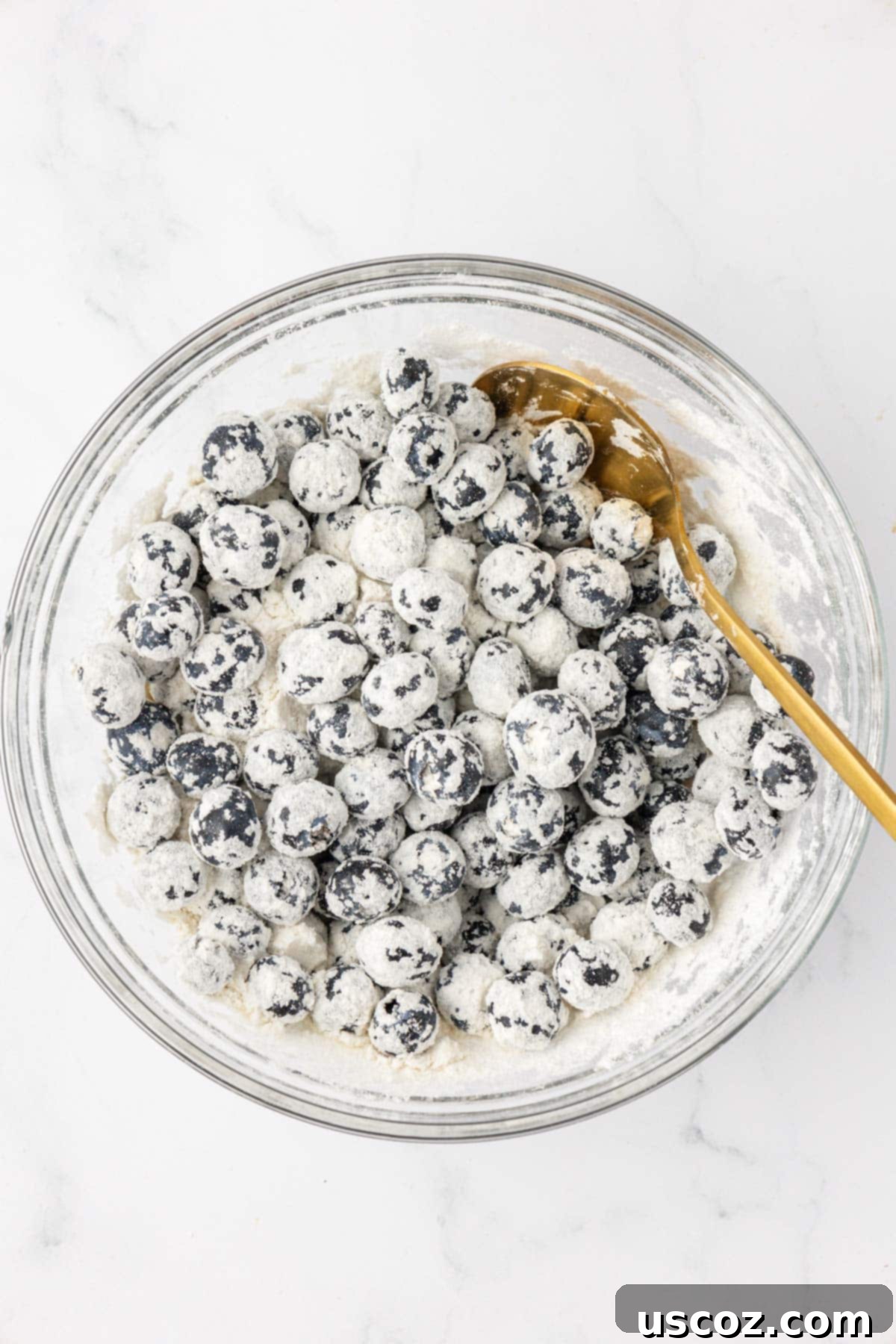 Sumptuous Sour Cream Blueberry Muffins 9 Fresh blueberries lightly tossed with flour in a bowl, a trick to prevent them from sinking.