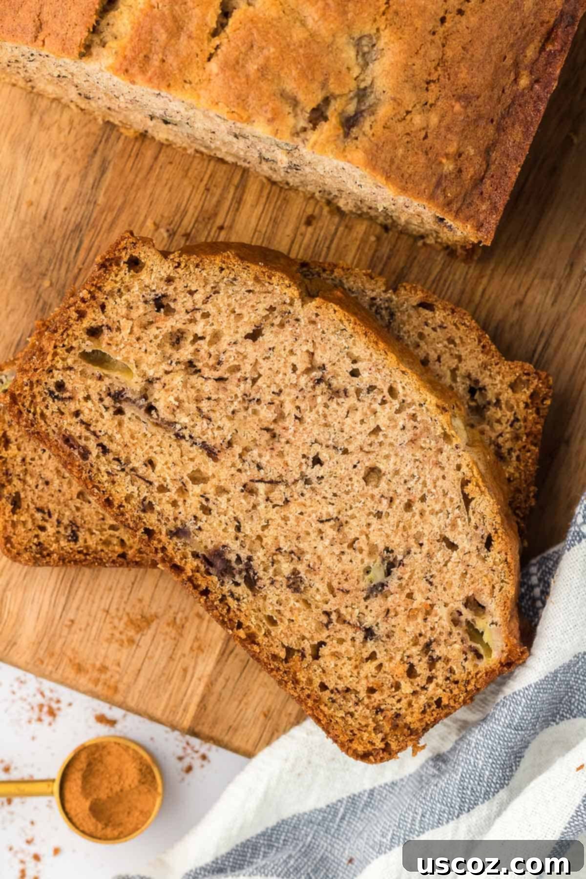 Ultimate Moist Banana Bread 17 A whole, beautifully baked loaf of classic banana bread, golden and inviting, ready for slicing.