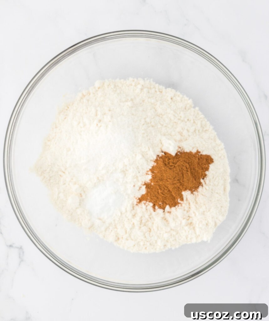 Ultimate Moist Banana Bread 9 Dry ingredients for banana bread – flour, salt, baking soda, and cinnamon – laid out in a bowl.