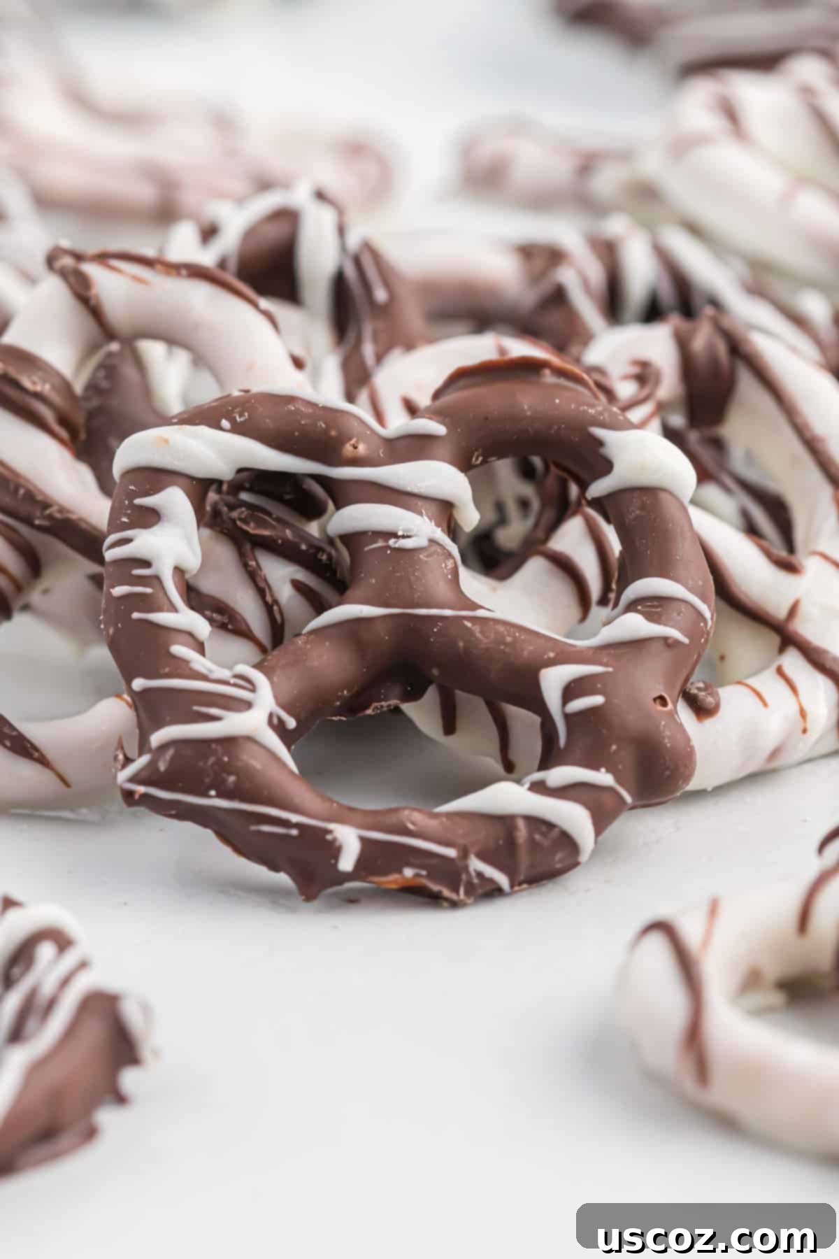Chocolate Pretzel Perfection 3 A close-up shot of a single chocolate covered pretzel, perfectly coated and ready to be picked up.